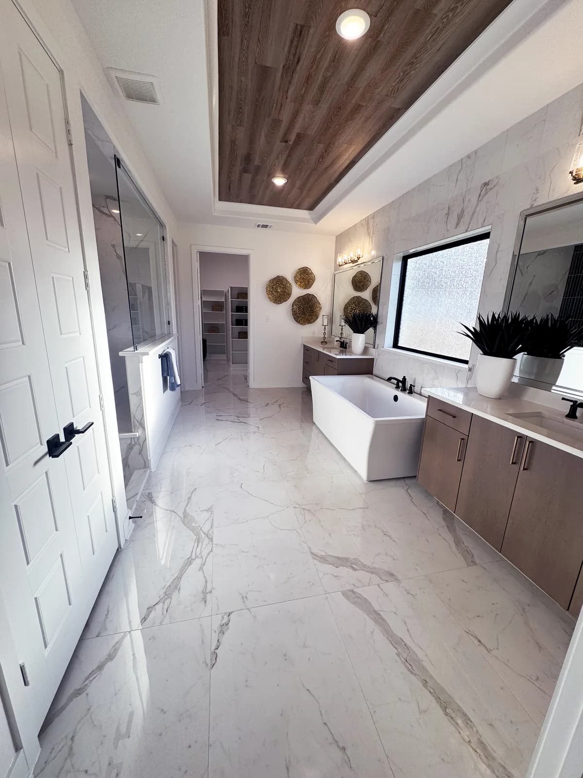 Finished bathroom with custom tile by Drakon Builders